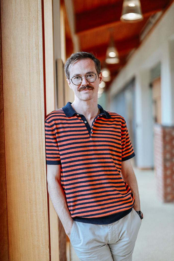 William Boyce in an orange striped shirt